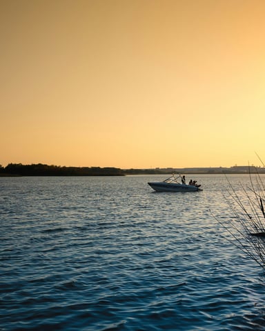 Fishing boat on Texas lake at sunset